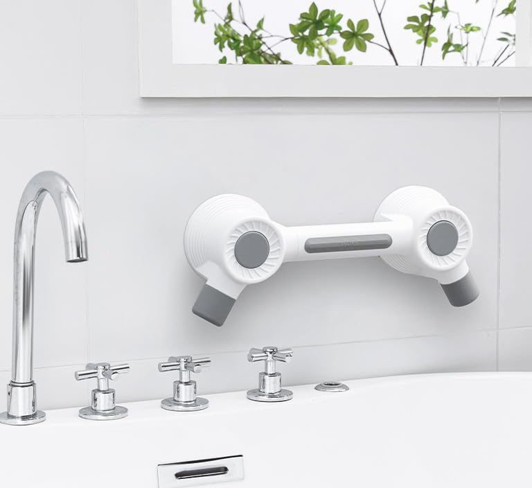 Adhesive grab bar mounted beside a bathtub