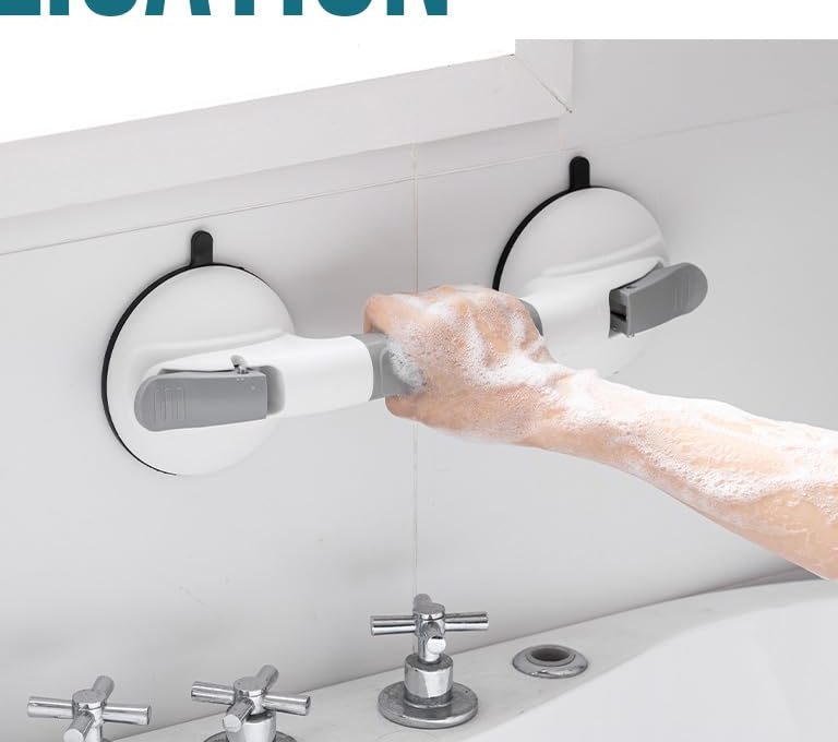 Hand reaching for a grab bar mounted above a bathroom sink